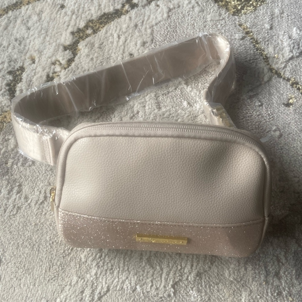 Joy belt bag can be worn dressy has some sparkle light tan